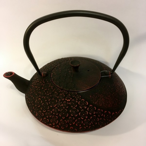 Théière en fonte noire et rouge