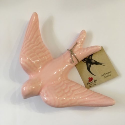Hirondelle en céramique rose tendre